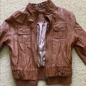 a brown leather jacket